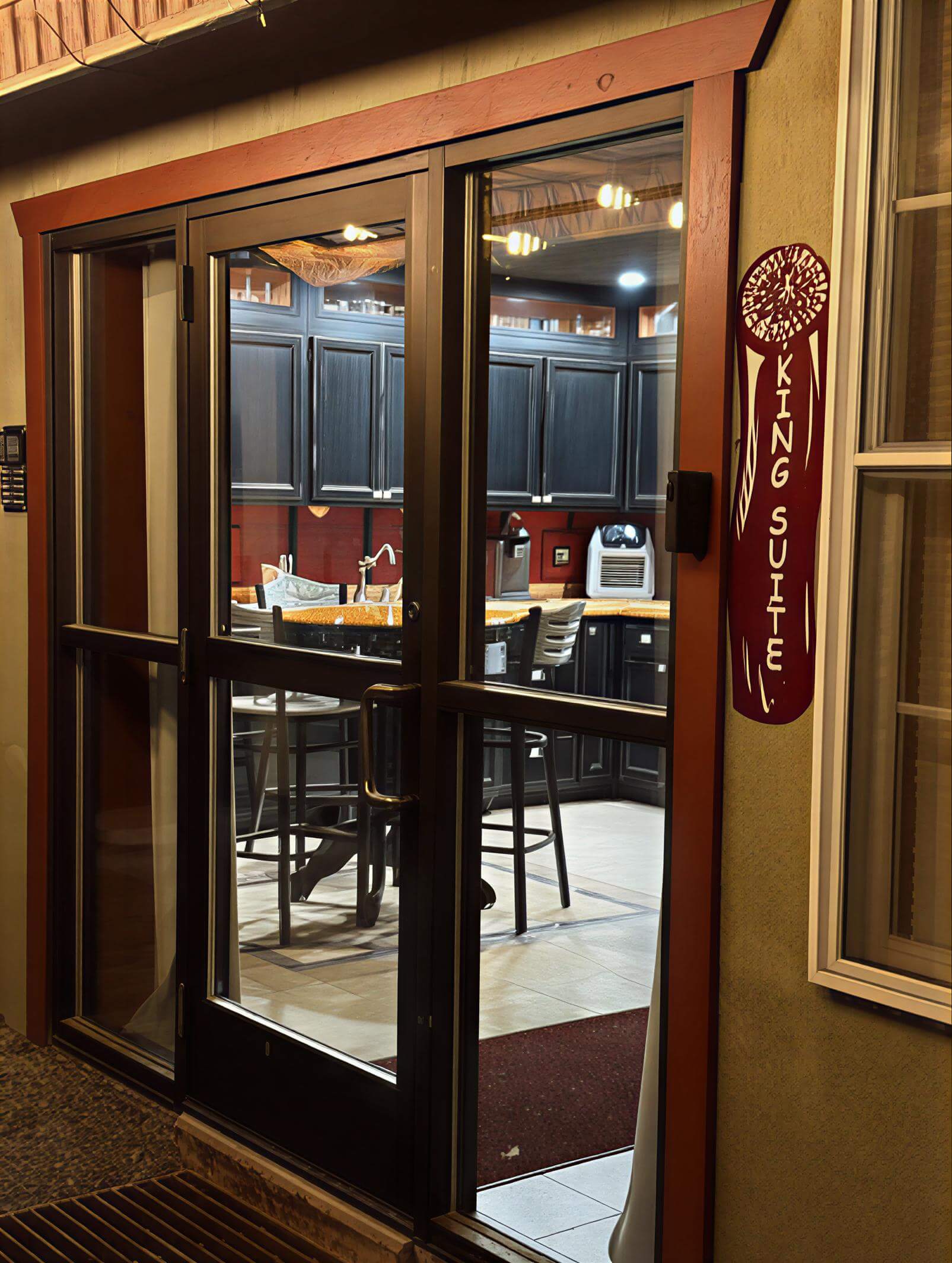Entrance to a cozy café or restaurant with a warm, inviting atmosphere.